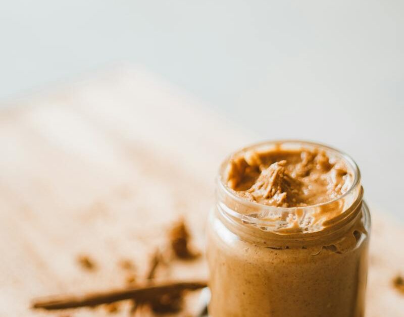 Jar with Peanut Butter on Table